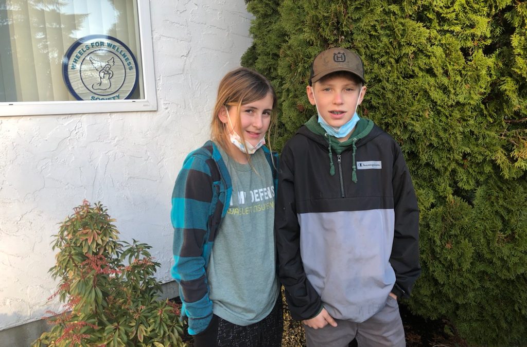 Siblings donate to Wheels for Wellness